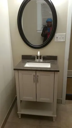 a bathroom with a sink and a mirror