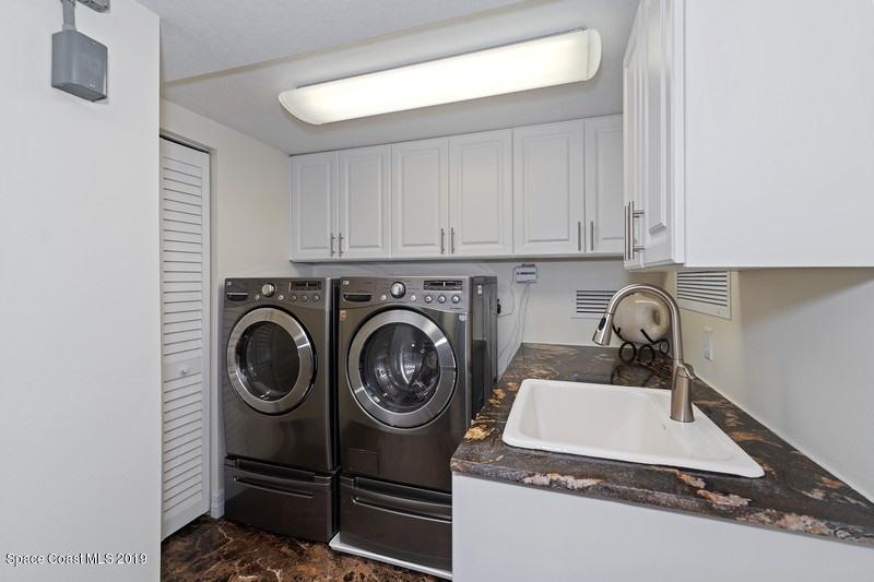 1323 Florida A1A, Unit 601 Satellite Beach, FL 32937 - Photo 36 of 45 49_1323HighwayA1A_601_44_LaundryRoom_Fle