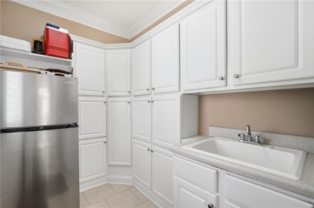 4147 Gold Mill Ridge Canton, GA 30114 - Photo 23 of 93 a view of a kitchen with white cabinets