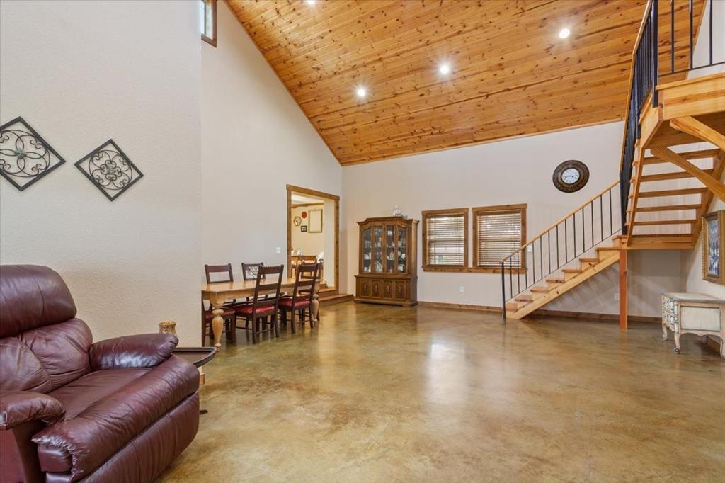 174 Ross Rd Spur Waco, TX 76705 - Photo 17 of 40 Knotted pinewood vaulted ceilings and staircase to loft