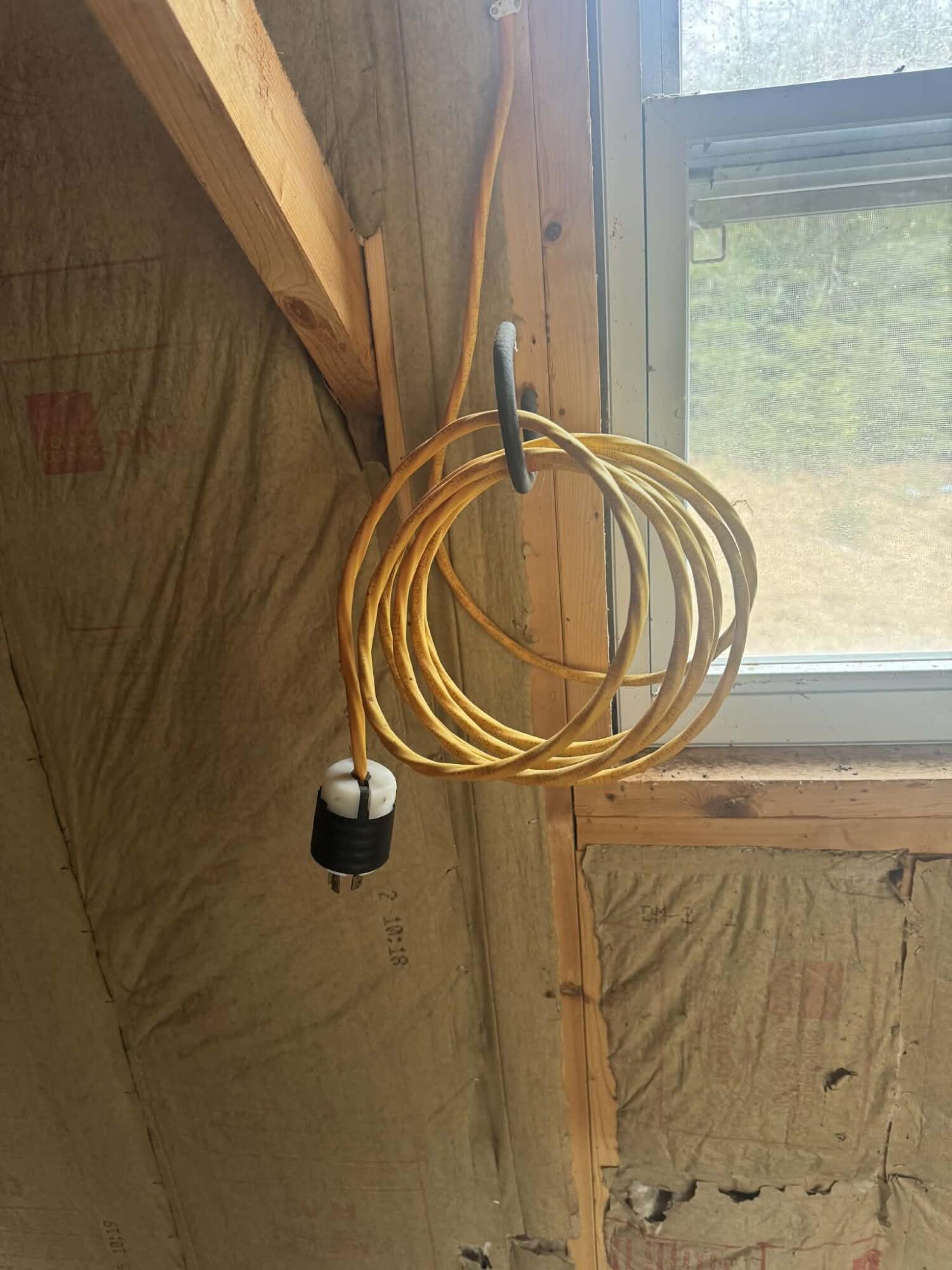 141 Cross Road Hancock, ME 04640 - Photo 45 of 46 generator cord in garage