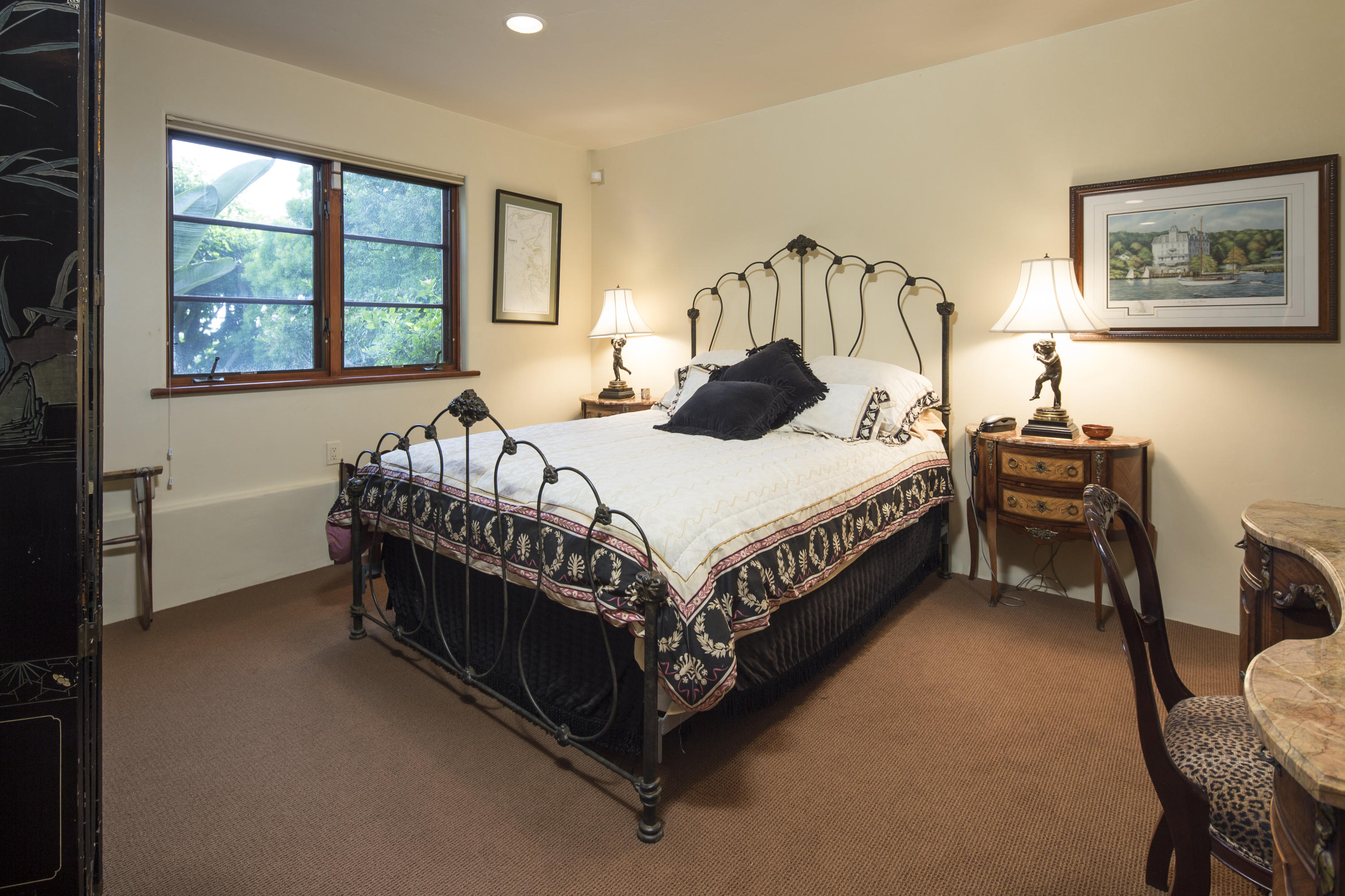 1214 High Ridge Lane Santa Barbara, CA 93103 - Photo 16 of 22 a bed sitting in a bedroom next to a window