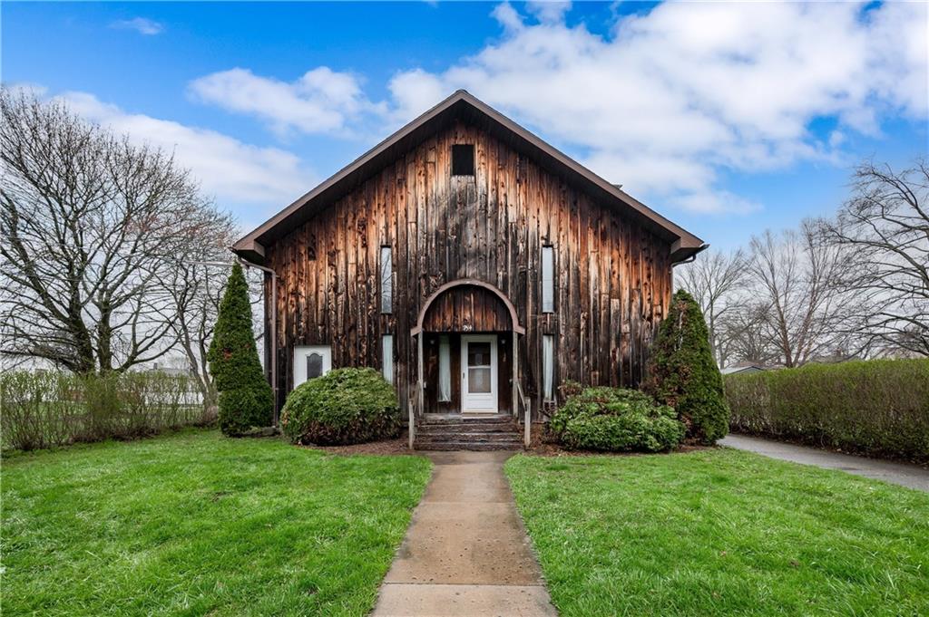 934 West Ridge Avenue Sharpsville, PA 16150 - Photo 1 of 38 a front view of a house with garden