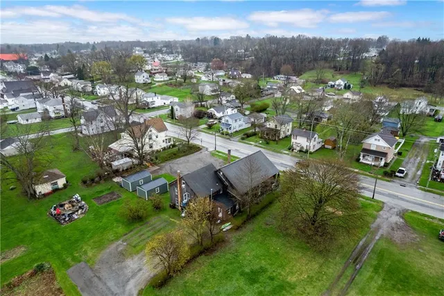 an aerial view of a house with a garden