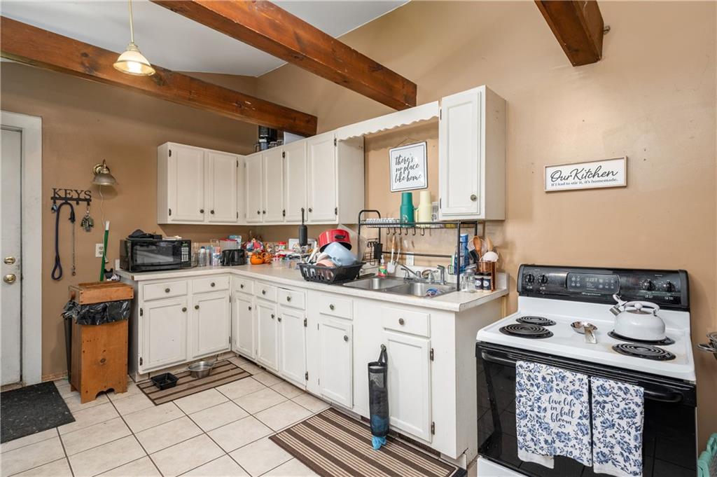 934 West Ridge Avenue Sharpsville, PA 16150 - Photo 29 of 38 a kitchen with granite countertop a sink stove and cabinets