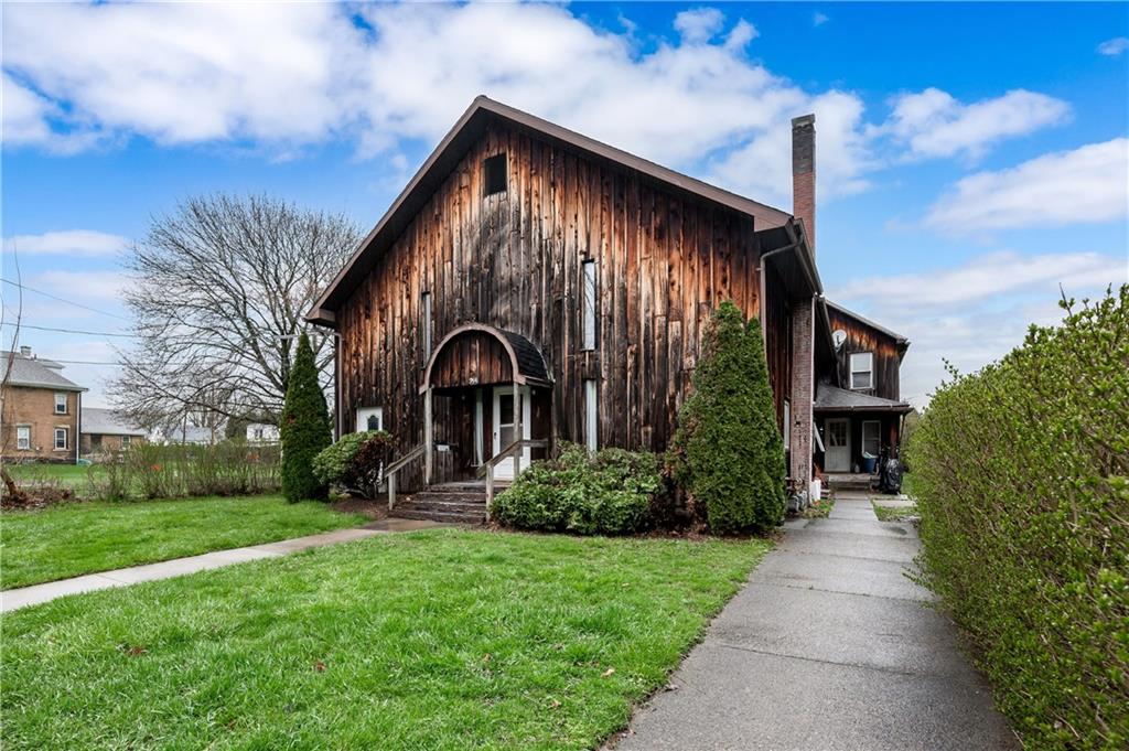 934 West Ridge Avenue Sharpsville, PA 16150 - Photo 3 of 38 a front view of a house with garden