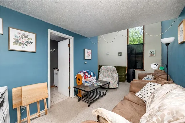 a bedroom with furniture and a bed