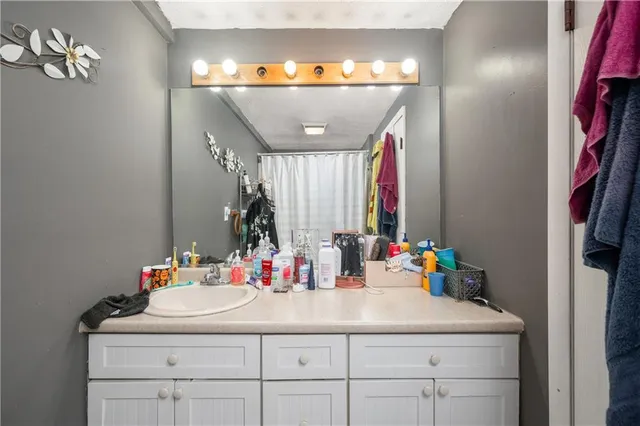 a bathroom with a sink and a mirror