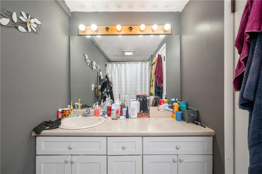934 West Ridge Avenue Sharpsville, PA 16150 - Photo 34 of 38 a bathroom with a sink and a mirror