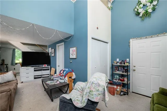 a bedroom with furniture and a flat screen tv