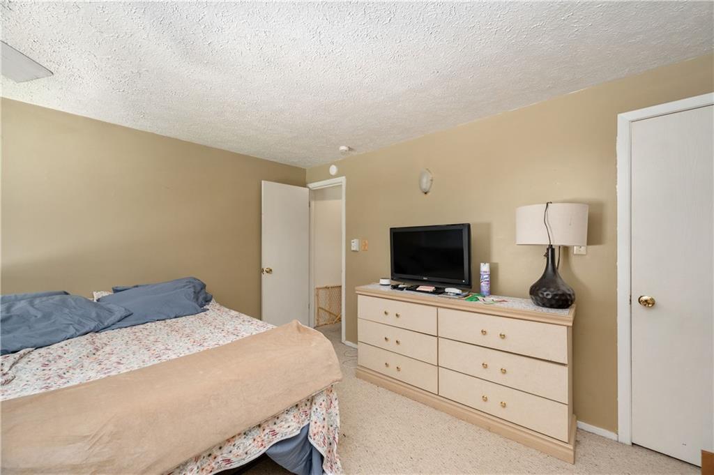 934 West Ridge Avenue Sharpsville, PA 16150 - Photo 37 of 38 a bedroom with a bed and a flat screen tv