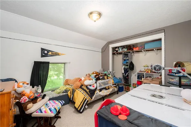 a bedroom with furniture and a gym equipment