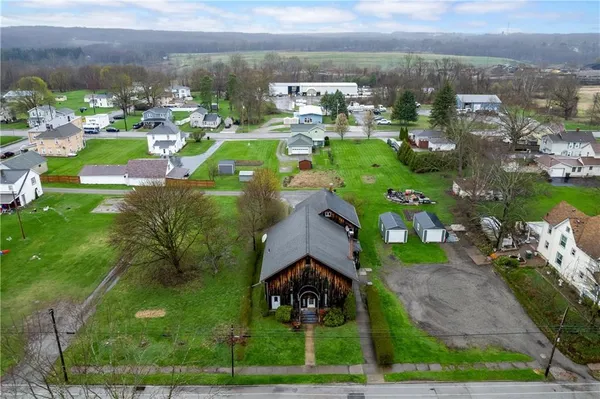 a view of multiple houses with yard