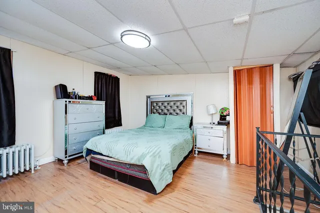 a spacious bedroom with a bed and a table