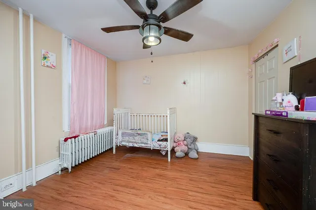 a bedroom with furniture and a window