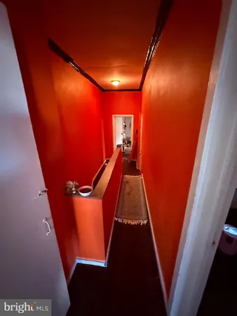 wooden floor with an entryway