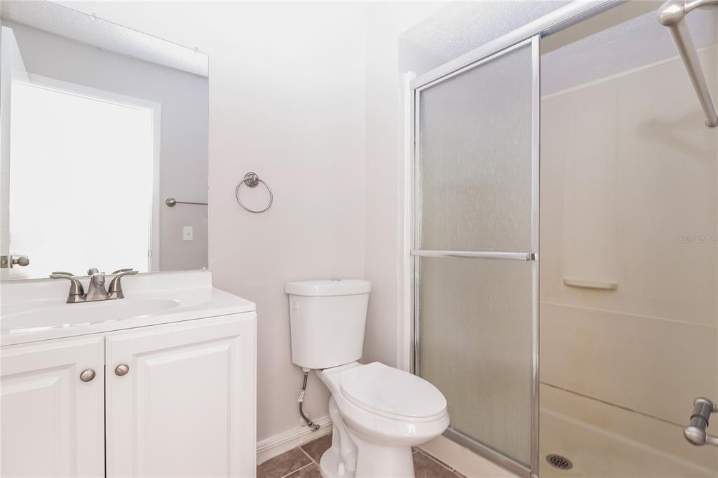 8104 Juarez Drive Port Richey, FL 34668 - Photo 11 of 15 a bathroom with a sink toilet and vanity