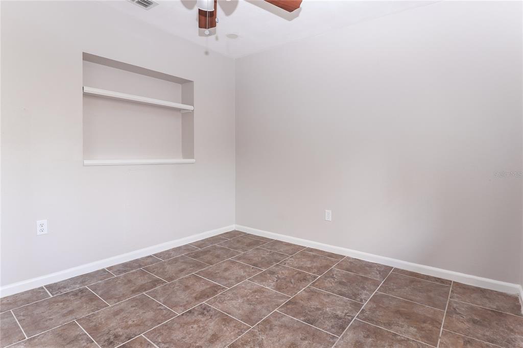 8104 Juarez Drive Port Richey, FL 34668 - Photo 14 of 15 a view of an empty room with a window