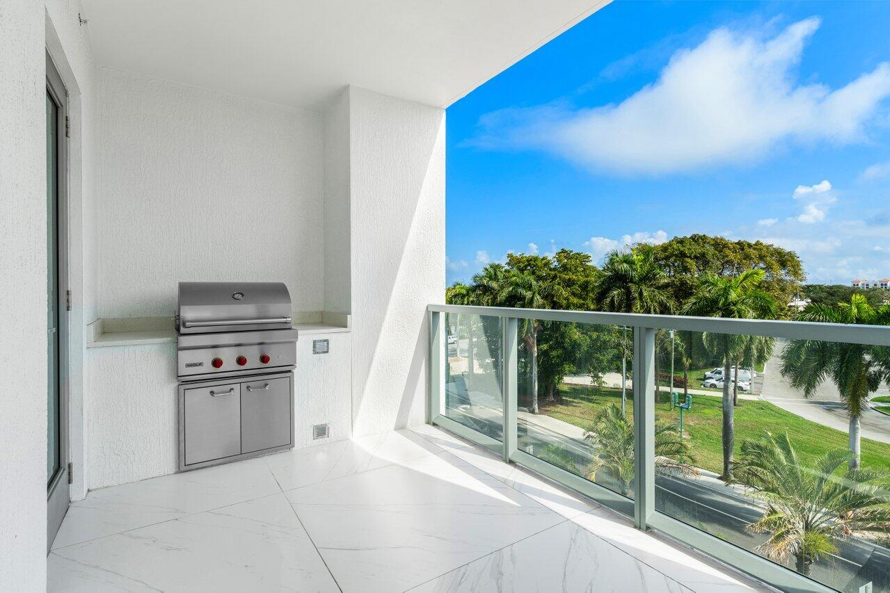 495 East Royal Palm Road, Unit 402 Boca Raton, FL 33432 - Photo 46 of 72 a kitchen with appliances cabinets and a large window