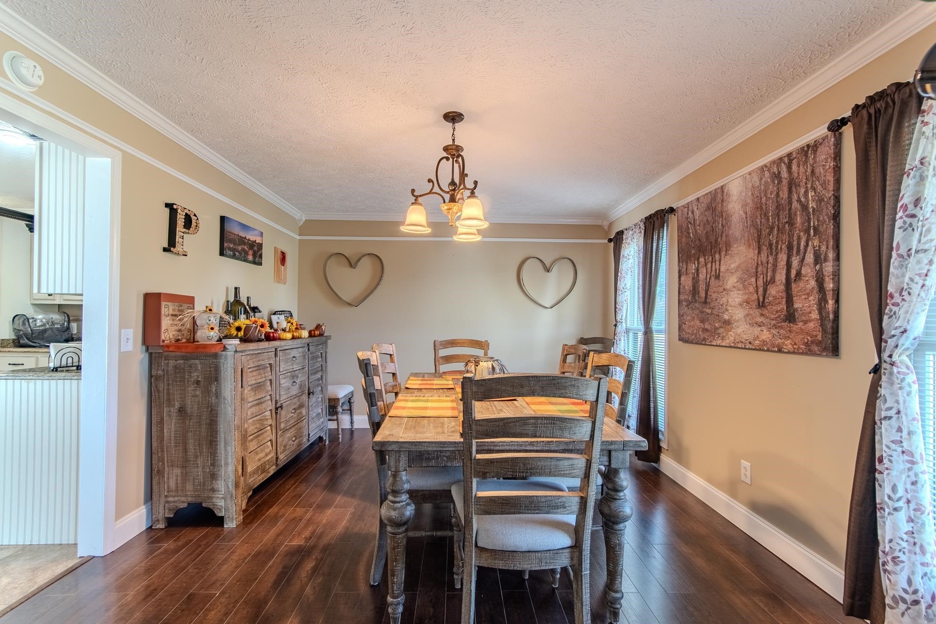 145 Tom Way Savannah, TN 38372 - Photo 11 of 40 a view of a dining room with furniture window and wooden floor