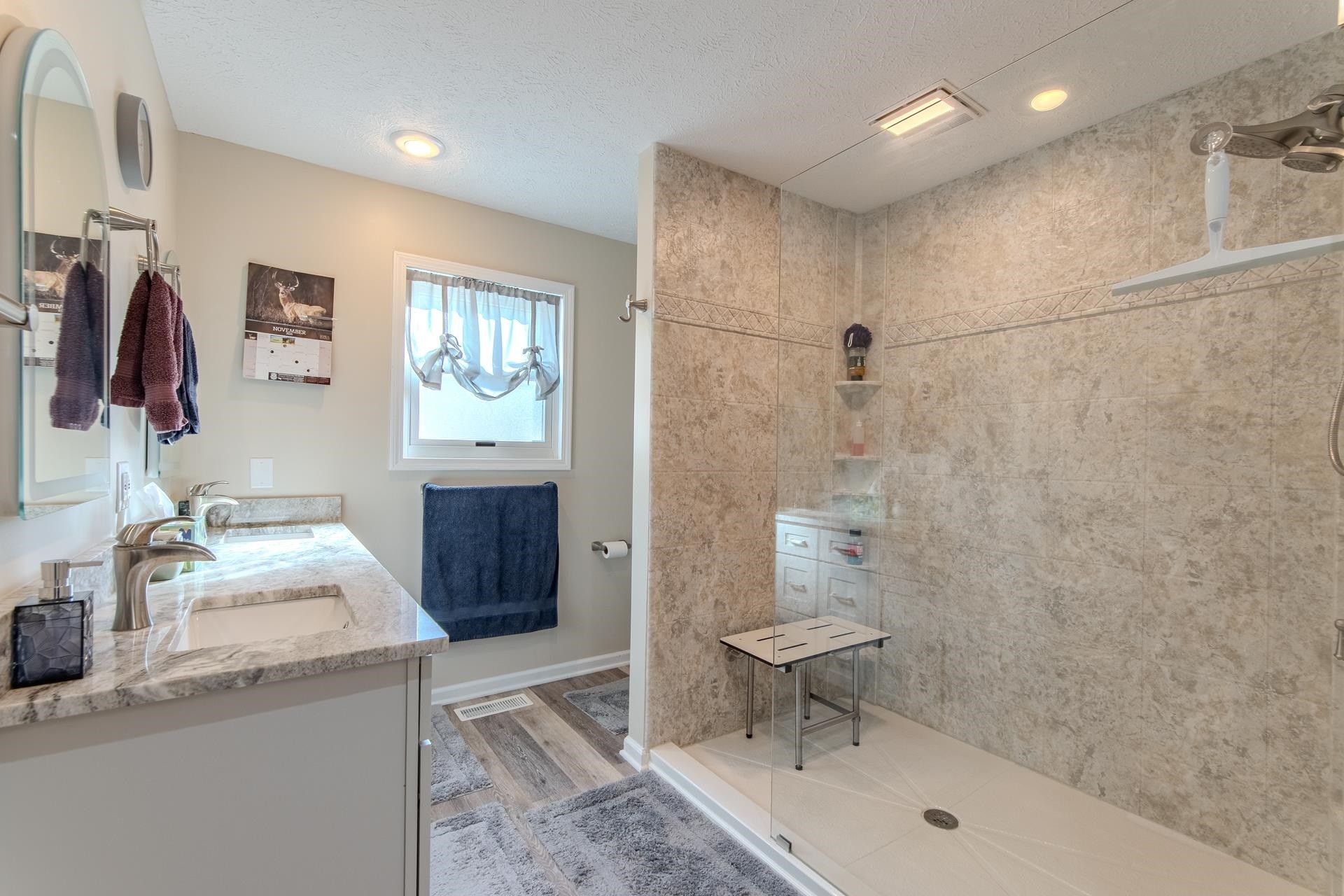 145 Tom Way Savannah, TN 38372 - Photo 15 of 40 a bathroom with a sink a toilet and shower
