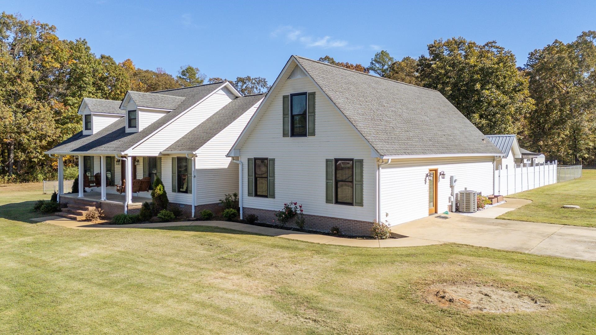 145 Tom Way Savannah, TN 38372 - Photo 26 of 40 a front view of house with yard outdoor seating and barbeque oven
