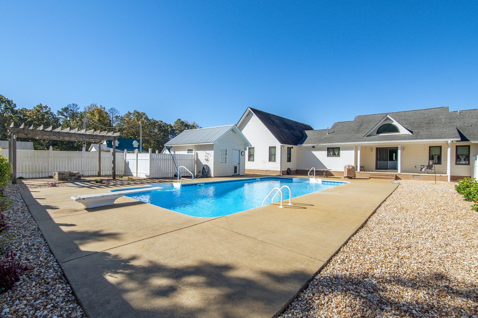145 Tom Way Savannah, TN 38372 - Photo 27 of 40 a view of house with swimming pool and lake view