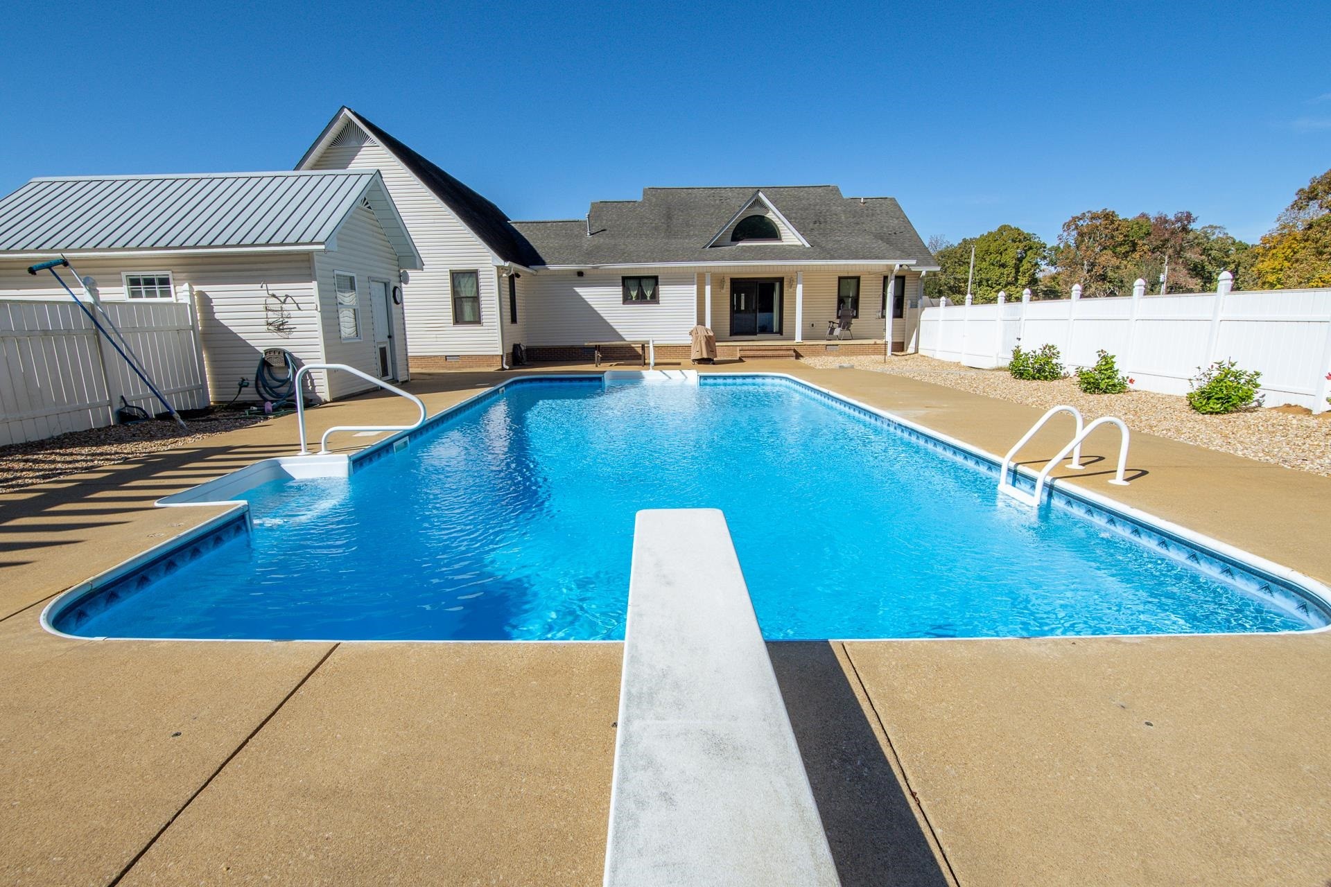 145 Tom Way Savannah, TN 38372 - Photo 29 of 40 a view of a house with pool and chairs