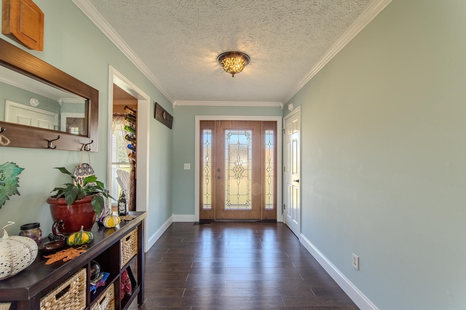 145 Tom Way Savannah, TN 38372 - Photo 3 of 40 a view of an entryway with wooden floor and a potted plant