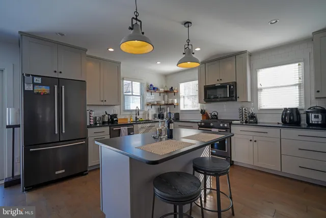 a kitchen with refrigerator cabinets and furniture