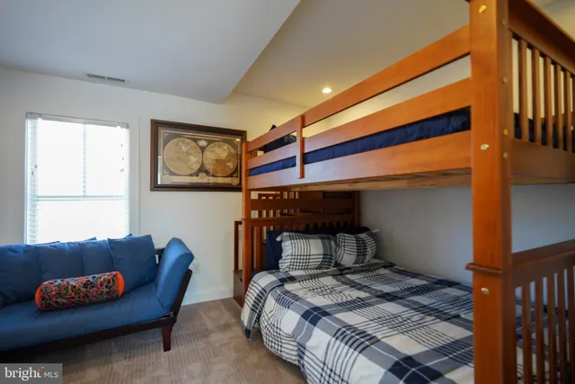 a bedroom with furniture and a couch