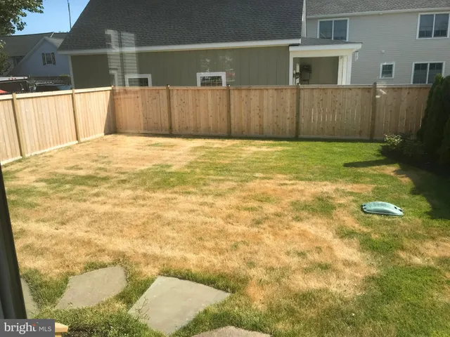 a view of a backyard of the house