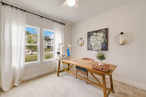 a dinning table and chairs in patio of the house