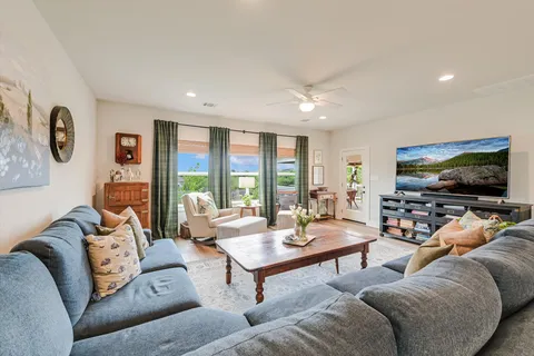 an aerial view of multiple houses with yard
