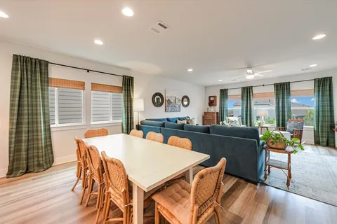 a view of a hallway view with wooden floor and staircase
