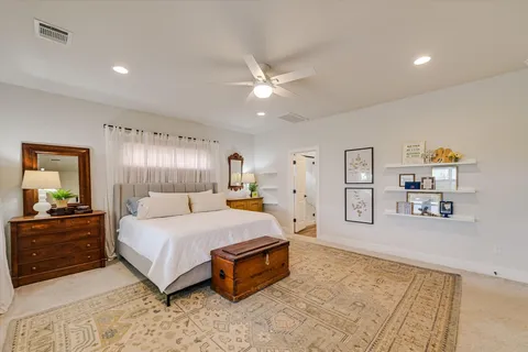 a bathroom with a sink a toilet and shower curtain