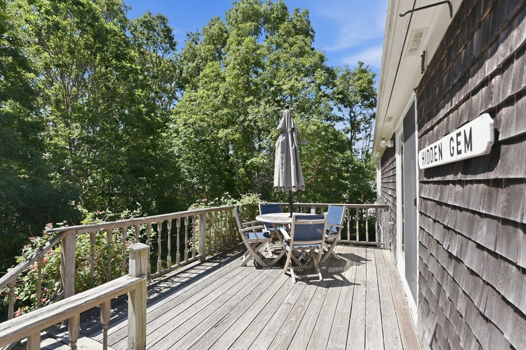 8 Emerald Way Sandwich, MA 02644 - Photo 30 of 36 a view of balcony with chairs and wooden fence