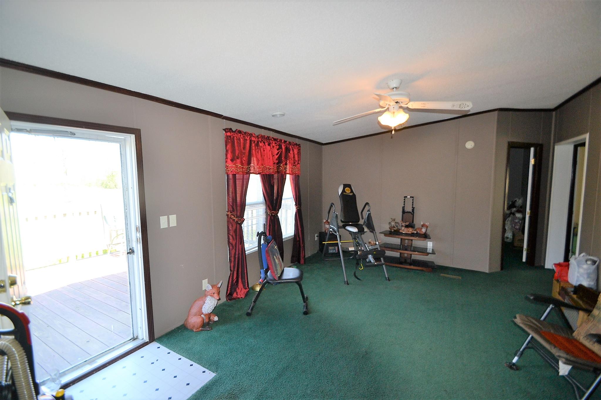 2553 Friendship Road Cross Plains, TN 37049 - Photo 12 of 30 a living room with furniture and a flat screen tv