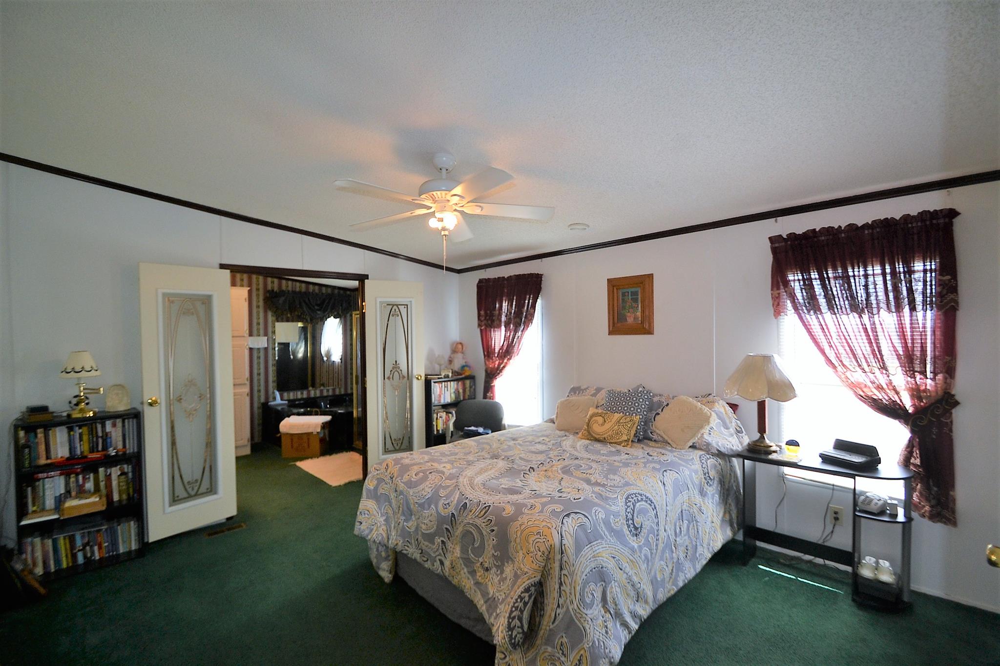 2553 Friendship Road Cross Plains, TN 37049 - Photo 24 of 30 a bedroom with a large bed and a chandelier