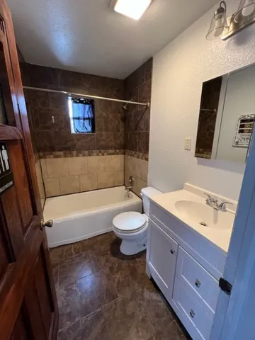 a bathroom with a toilet a sink and a bathtub