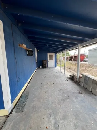 a view of an empty room with a fireplace