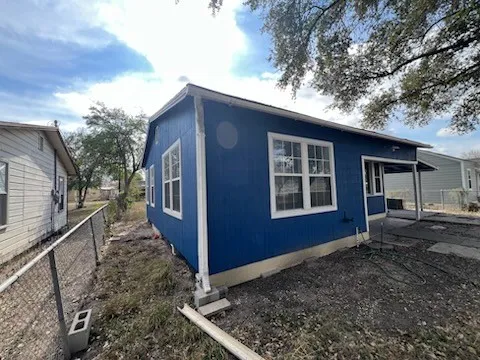 a front view of a house with fence