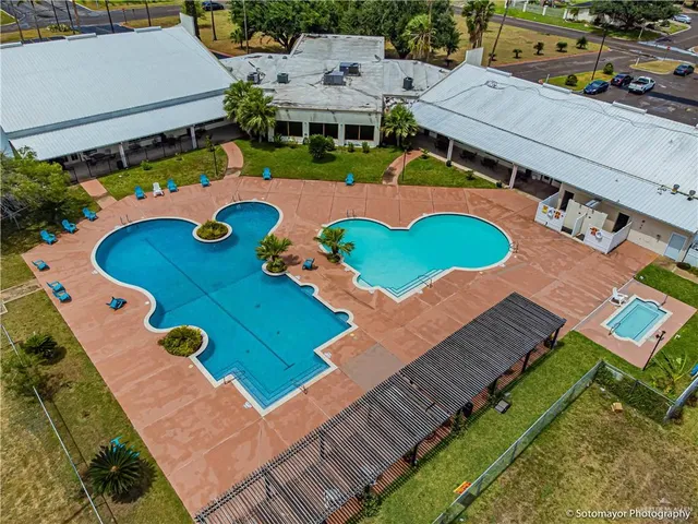 an aerial view of a house with yard