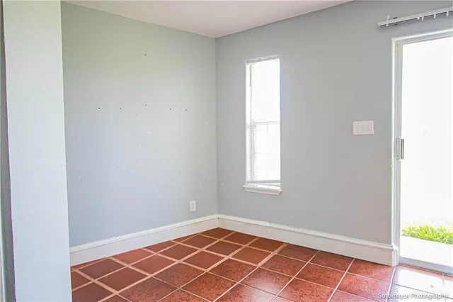 a view of an empty room and window