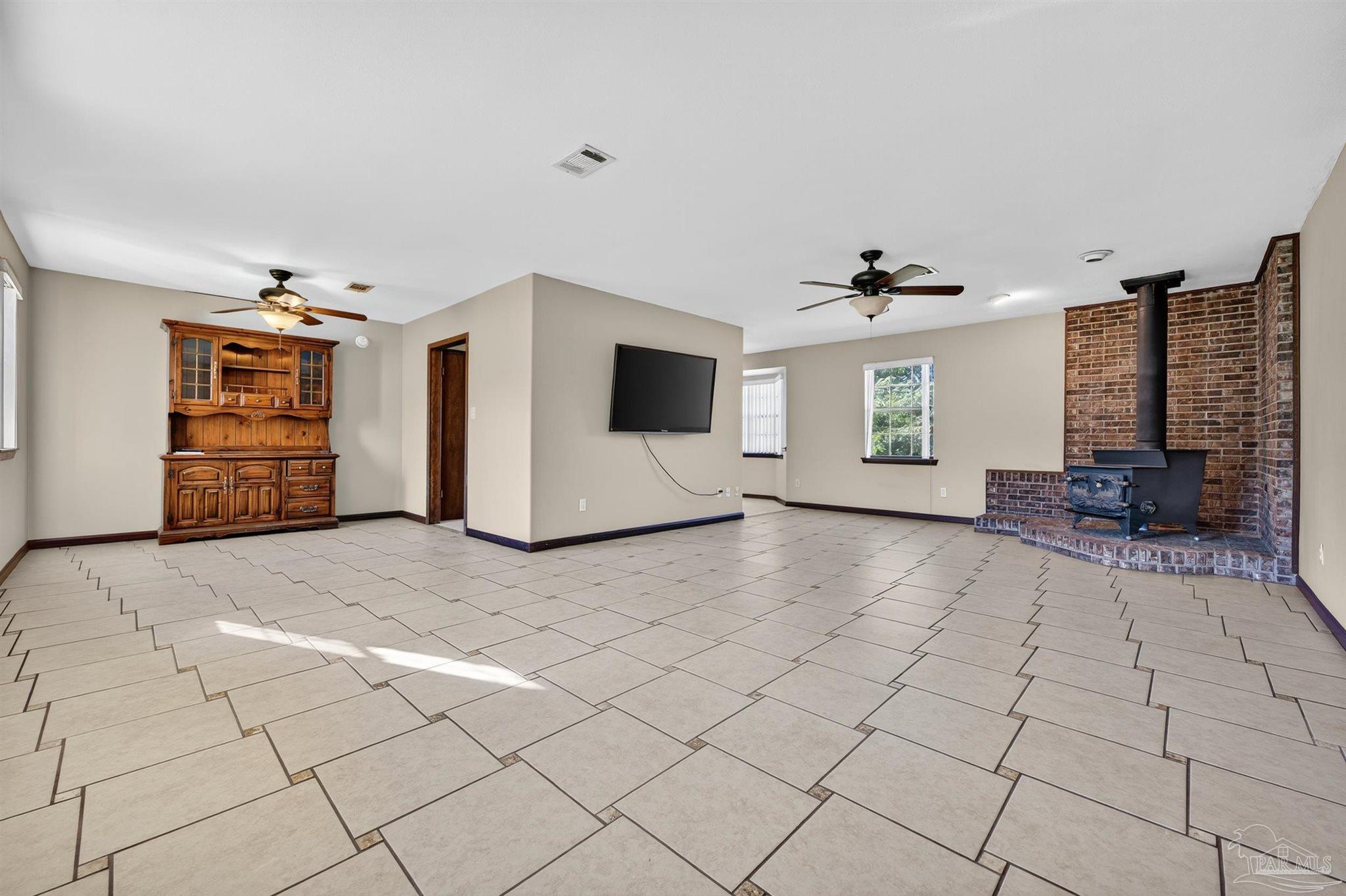 1120 Muscogee Road Cantonment, FL 32533 - Photo 12 of 38 a view of an empty room with a window