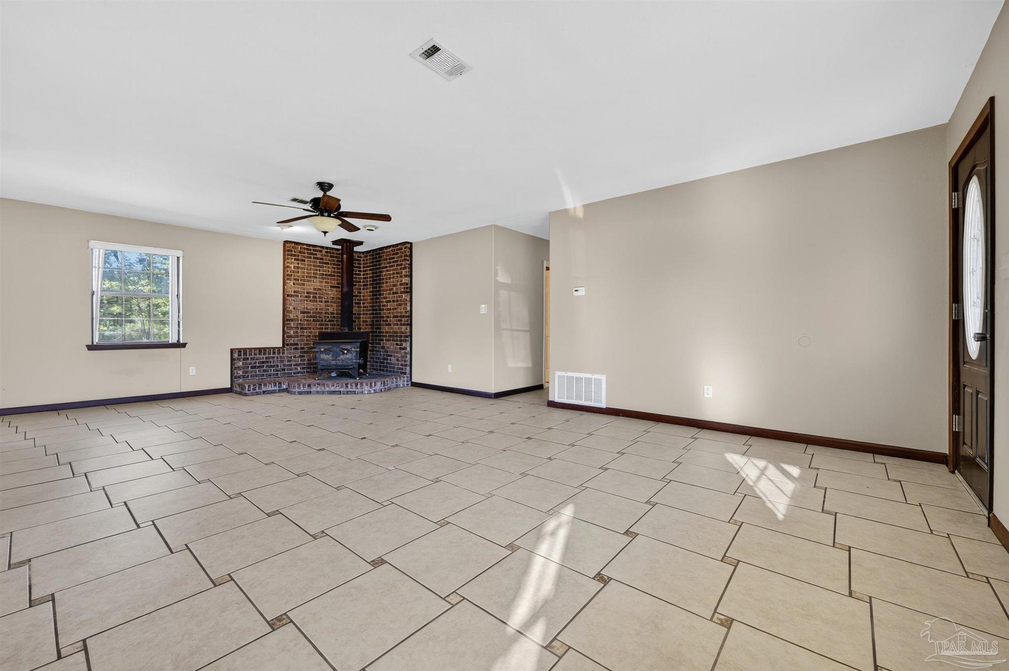 1120 Muscogee Road Cantonment, FL 32533 - Photo 15 of 38 a view of an empty room and window