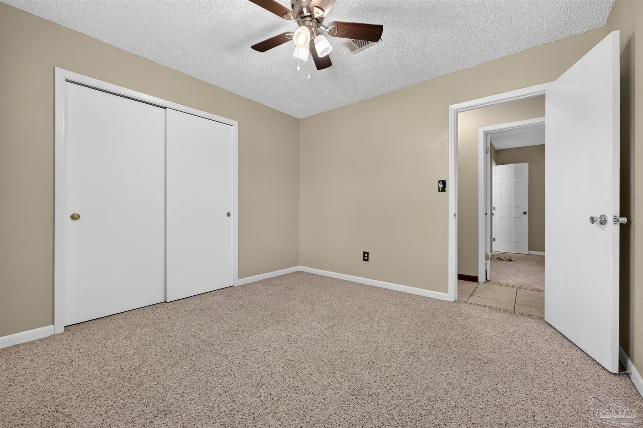 1120 Muscogee Road Cantonment, FL 32533 - Photo 17 of 38 a view of an empty room