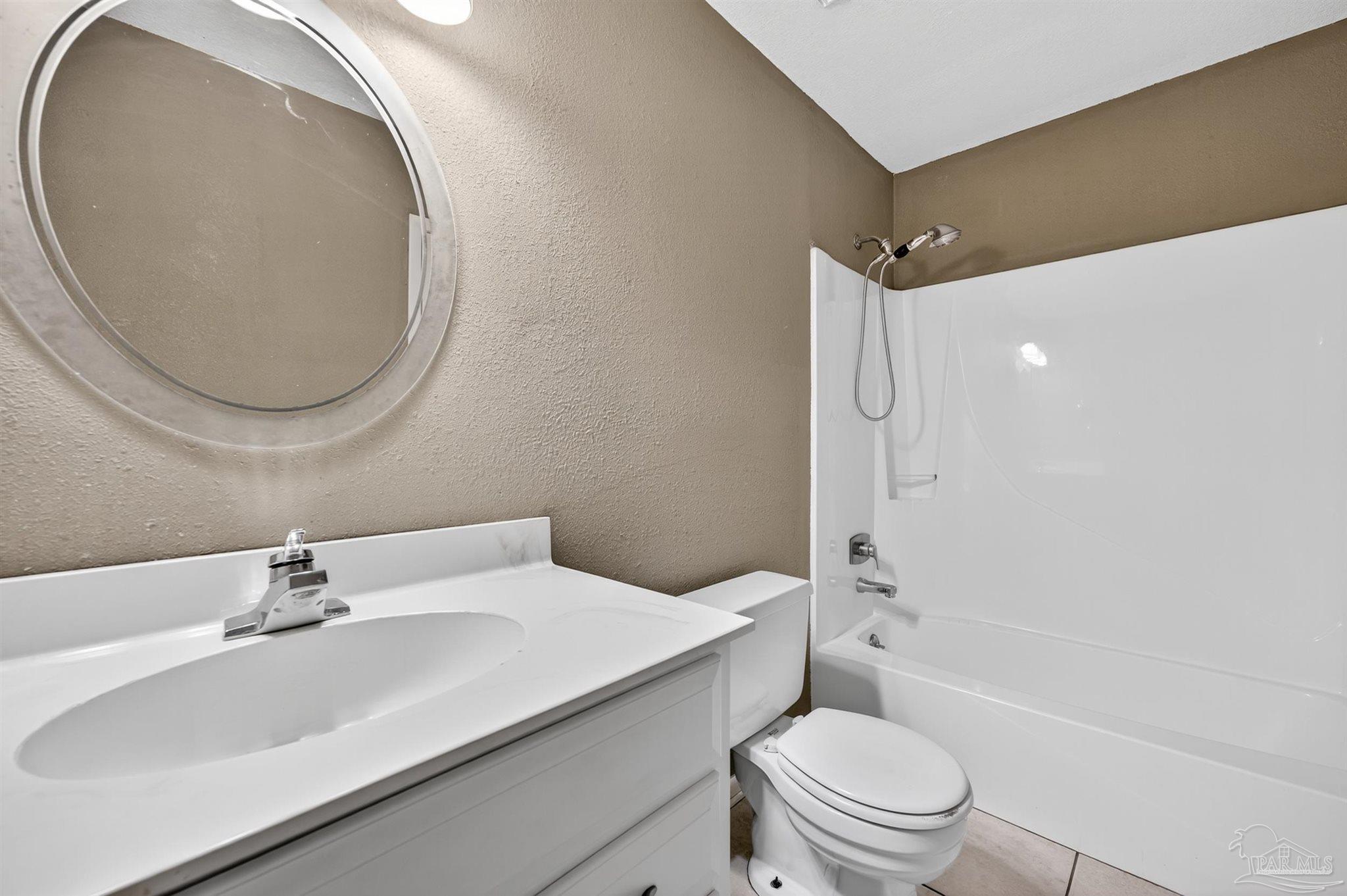 1120 Muscogee Road Cantonment, FL 32533 - Photo 18 of 38 a bathroom with a sink toilet and shower