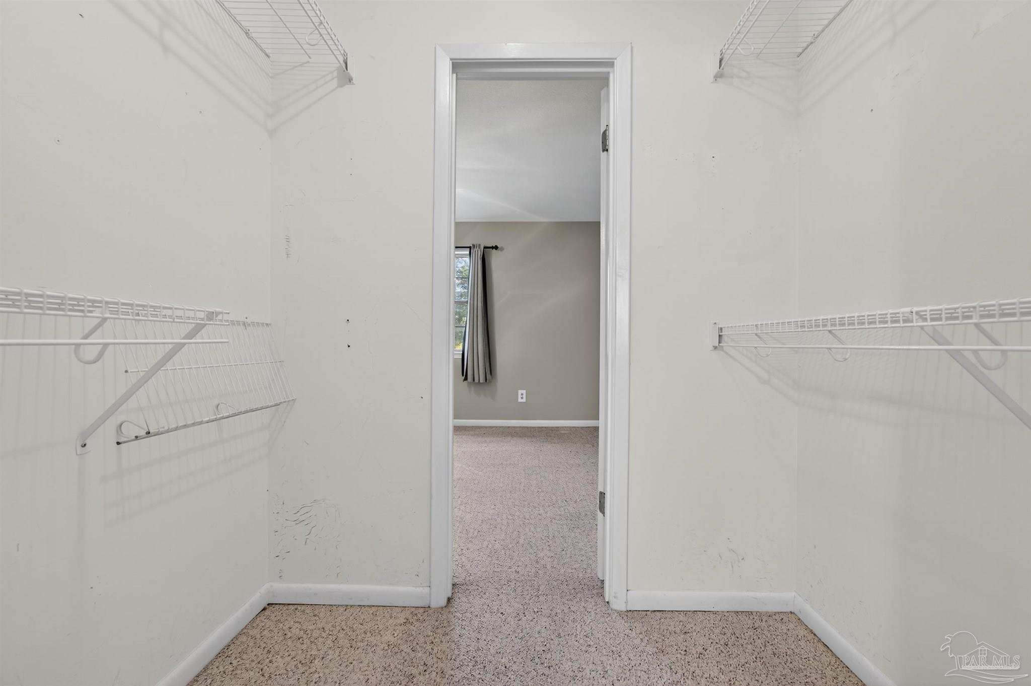 1120 Muscogee Road Cantonment, FL 32533 - Photo 19 of 38 a view of an empty walk in closet