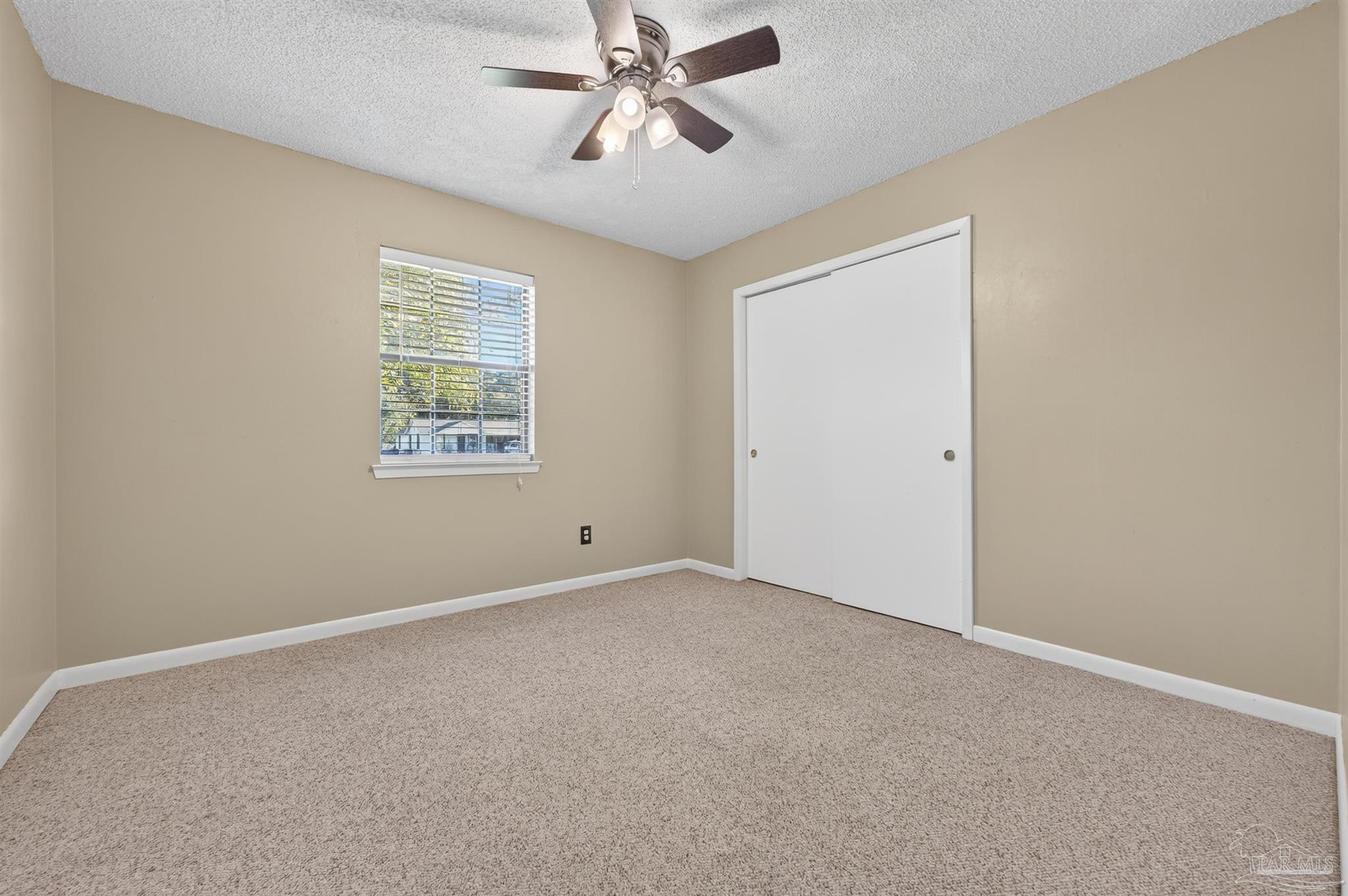 1120 Muscogee Road Cantonment, FL 32533 - Photo 20 of 38 a view of an empty room with a window